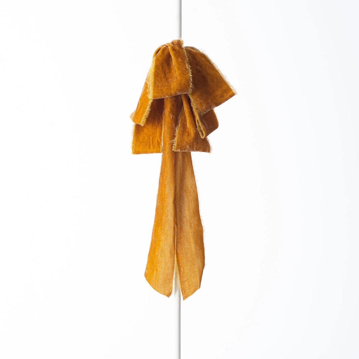 Yulemere golden mustard raw edge velvet drape loop bow overall view
